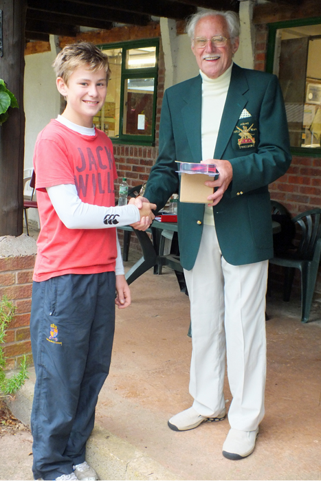 Photograph shows M. Bruce (pictured left) receiving the Staffordshire Open 'Top Junior' Prize from SSRA President, Major (Retired) Peter Martin, MBE (pictured right).