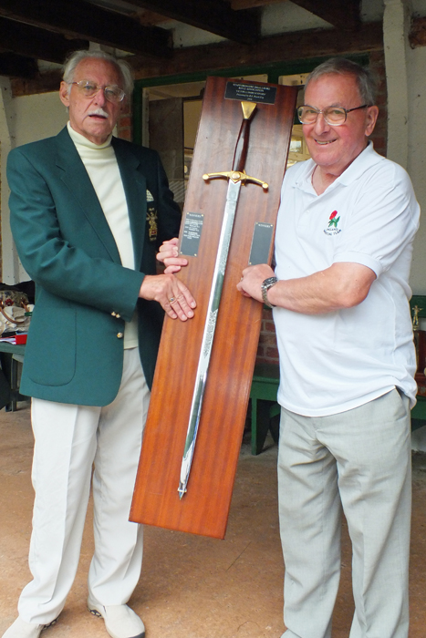 Photograph shows M.B.P. Willcox (pictured right) receiving the Wilkinson Sword from SSRA President, Major (Retired) Peter Martin, MBE (pictured left).