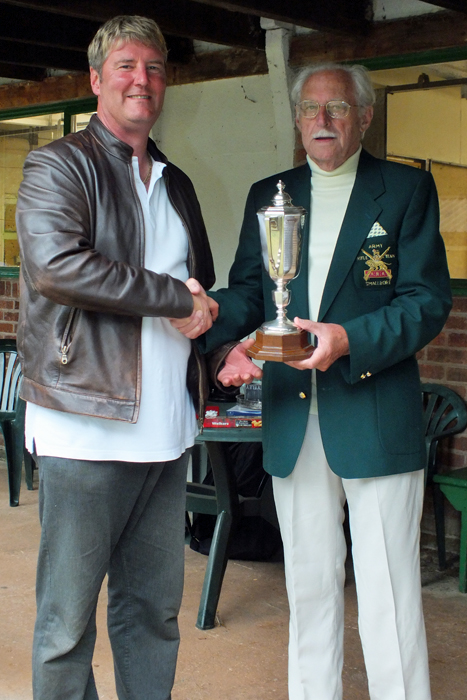 Photograph shows N. Almond, pictured left, receiving The Albert Greatrex Cup from SSRA President - Major (Retired) Peter Martin, MBE.