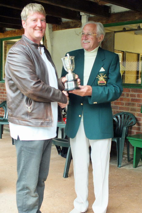 Photograph shows N. Almond (pictured left) receiving the Association Cup from SSRA President, Major (Retired) Peter Martin, MBE (pictured right).