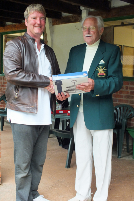 Photograph shows N. Almond (pictured left) receiving the Class 'A' Second Place Prize from SSRA President, Major (Retired) Peter Martin, MBE (pictured right).
