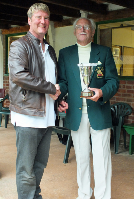 Photograph shows N. Almond, pictured left, receiving the Miniature Rifle Challenge Cup from SSRA President - Major (Retired) Peter Martin, MBE.