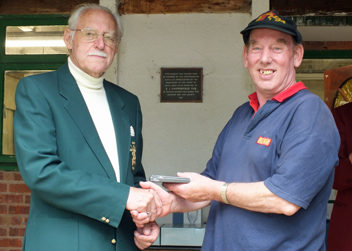 Photograph shows SSRA President - Major (Retired) Peter Martin MBE, pictured left - presenting the Moat Cup Third Place Medal to B. Parker, pictured right.