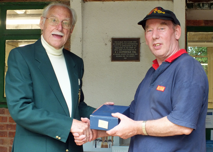 Photograph shows B. Parker (pictured right) receiving the Class 'C' Third Place Prize from SSRA President, Major (Retired) Peter Martin, MBE (pictured left)