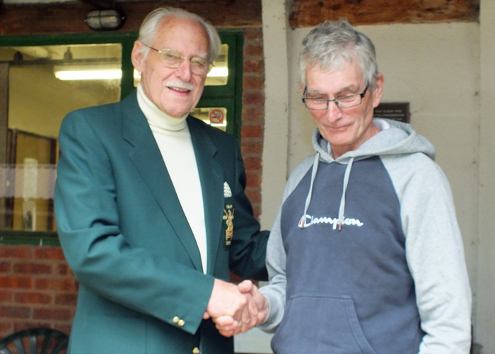 Photograph shows SSRA President - Major (Retired) Peter Martin MBE, pictured left - presenting the Miniature Rifle Cup Second Place Medal to B. Tonks, pictured right.