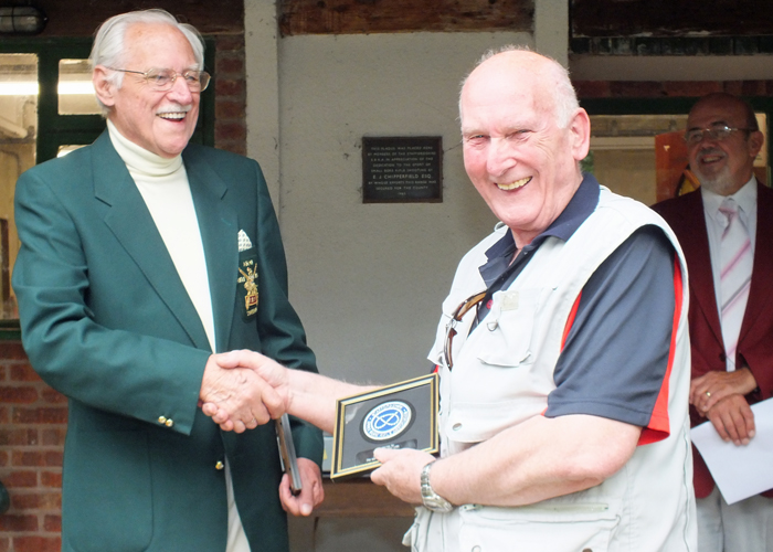 Photograph shows SSRA President - Major (Retired) Peter Martin MBE, pictured left - presenting a Special Award from the SSRA for Services to County Shooting - to F. Jennings, pictured right.