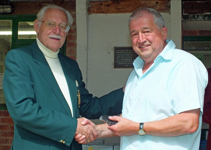 Photograph shows SSRA President - Major (Retired) Peter Martin MBE, pictured left - presenting the Moat Cup Second Place Medal to J. Wilshaw, pictured right.