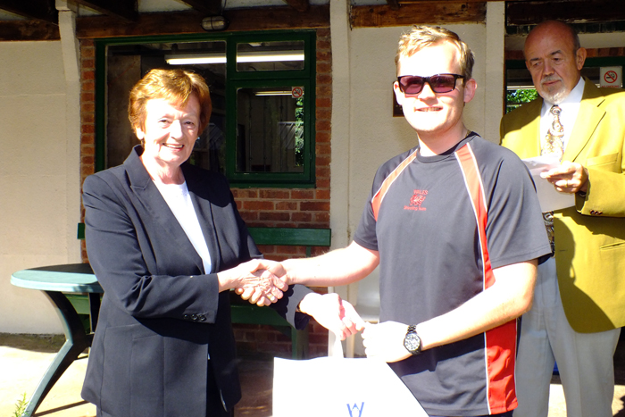 Photograph shows Mary Jennings, pictured left, presenting the Class A 2nd Place Prize to Ryan Williams, pictured right.