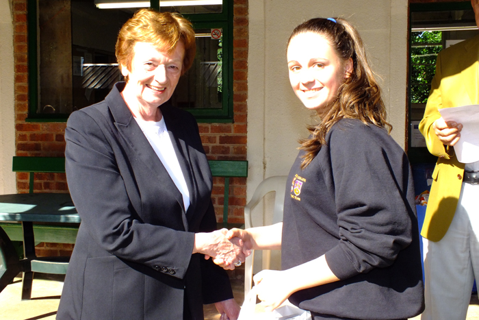 Photograph shows Mary Jennings, pictured left, presenting the Class B 1st Place Prize to Shannon Davies, pictured right.