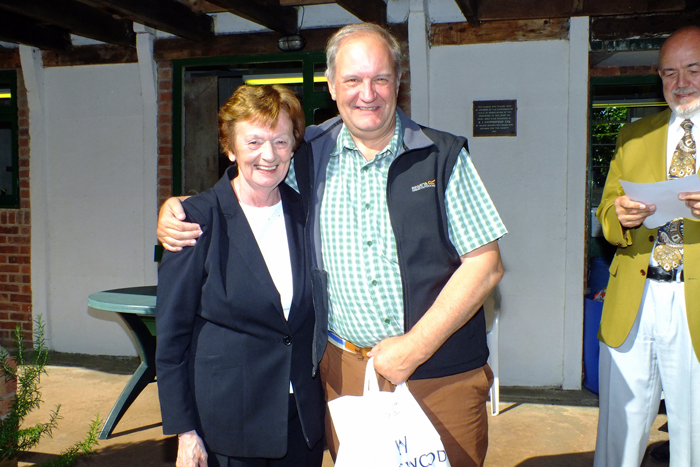 Photograph shows Mary Jennings, pictured left, presenting the Class B 2nd Place Prize to Bob Heath, pictured right.