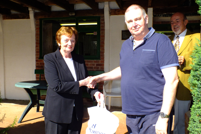 Photograph shows Mary Jennings, pictured left, presenting the Class C 2nd Place Prize to Ivor Leigh, pictured right.
