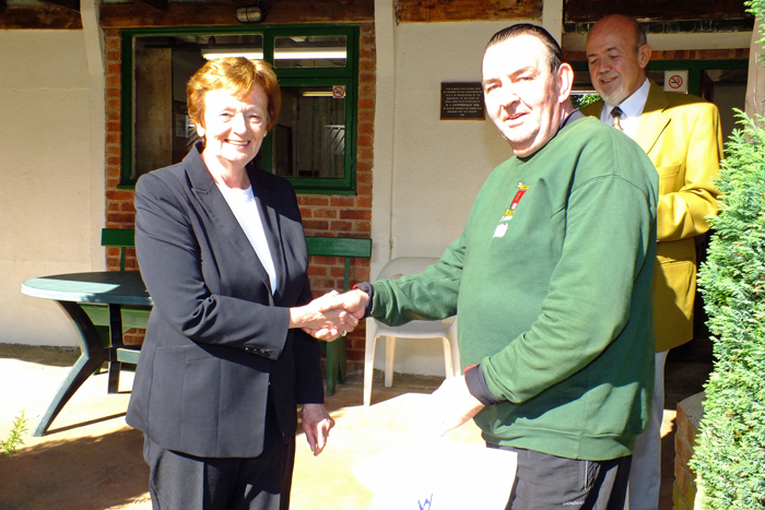 Photograph shows Mary Jennings, pictured left, presenting the Class C 3rd Place Prize to Jimmy Hibbert, pictured right.