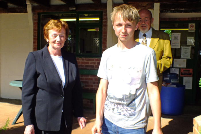 Photograph shows Mary Jennings, pictured left, presenting the Class D 3rd Place Prize to Alan Barn, pictured right.