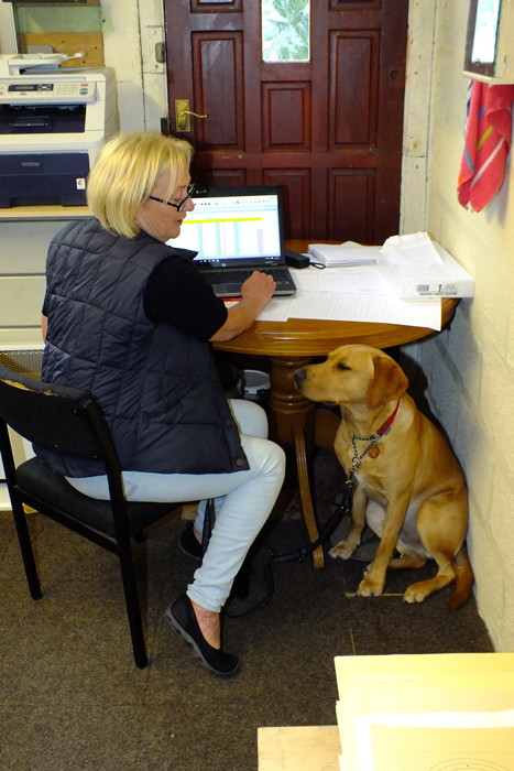 Photograph shows Debbie, another valued member of the official scoring team, working tirelessly compiling the scores.