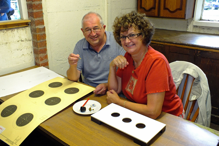 Photograph shows John Wilshaw (pictured left) and Judith Simcock (pictured right). More members of the scoring team, busy doing their thing.