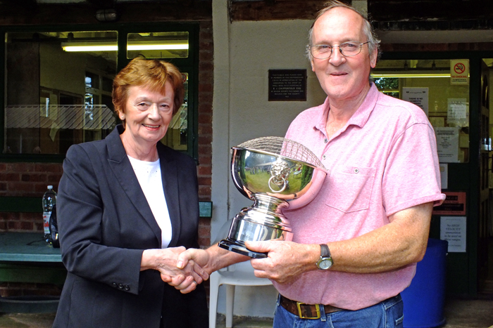 Photograph shows Mary Jennings, pictured left, presenting the K. Madeley Rose Bowl to Gordon Abbots, pictured right.