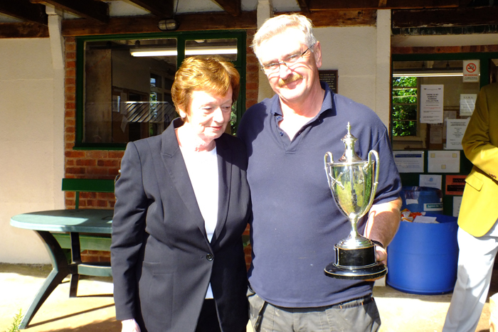 Photograph shows Mary Jennings, pictured left, presenting the Michelin Cup to Peter Dean, pictured right.