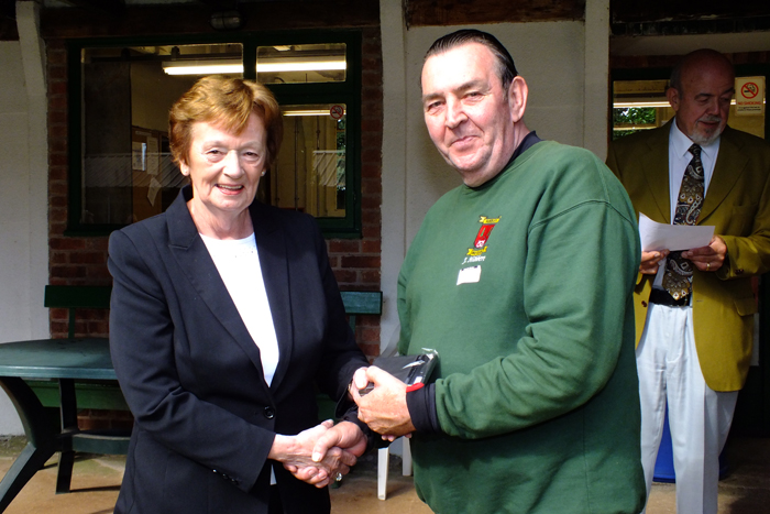 Photograph shows Mary Jennings, pictured left, presenting the Staffordshire Class 'C' Aggregate 3rd Place Medal to Jimmy Hibbert, pictured right.