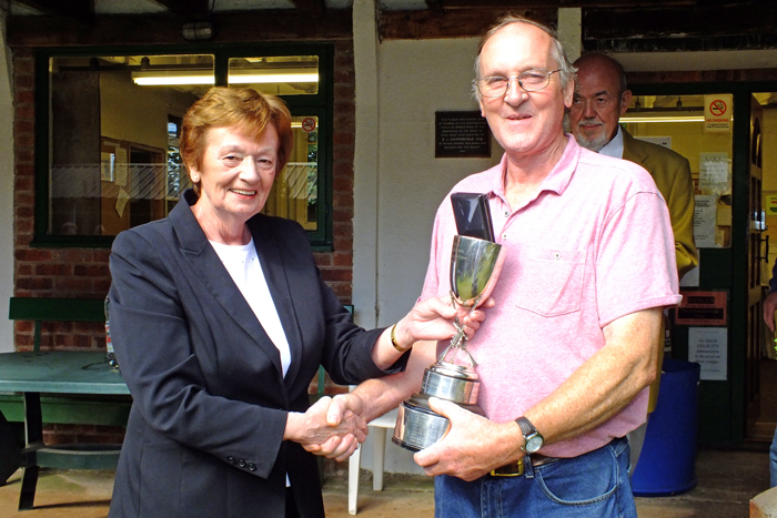 Photograph shows Mary Jennings, pictured left, presenting the Swynnerton Cup and Staffordshire Class 'B' Aggregate 1st Place Medal to Gordon Abbots, pictured right.