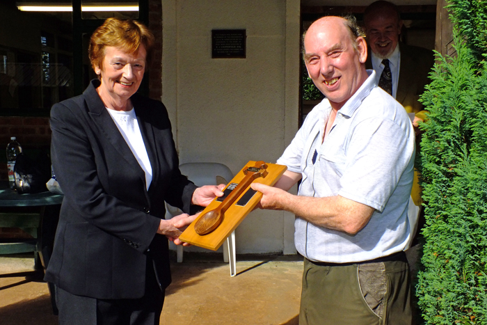Photograph shows Mary Jennings, pictured left, presenting the Wooden Spoon to Brian Parker, pictured right.