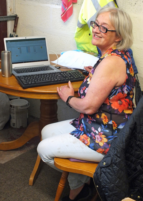 Photograph shows Debbie Round, Clerk to the Scorers, working tirelessly compiling the scores.
