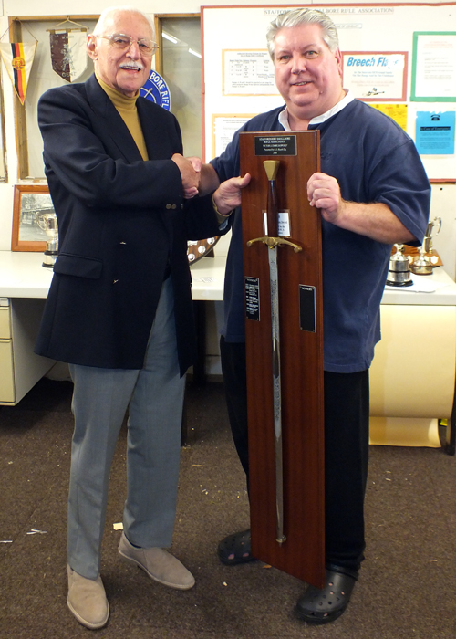 Photograph shows SSRA President - Major (Retired) Peter Martin MBE, pictured left - presenting the Wilkinson Sword to Paul D Barker, pictured right.