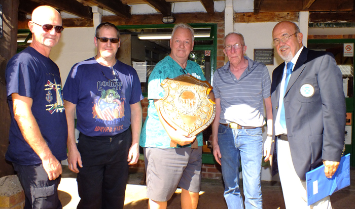 Photograph shows SSRA Chairman - Richard Tilstone (pictured right), presenting the Association Shield to members of Rugeley Rifle Club (pictured left).