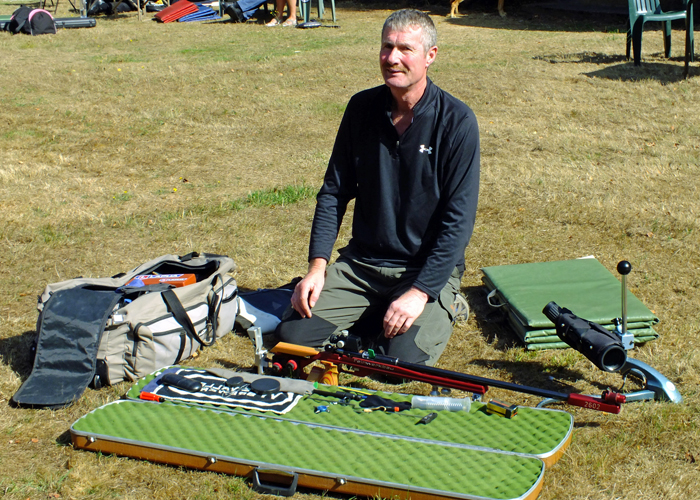 Photograph shows a methodical approach taken by a competitor in laying out his kit prior to shooting.