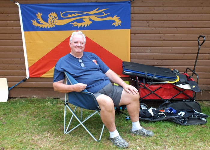 Photograph shows a very relaxed Lee Featherstone enjoying the sunshine before the heat of battle on the firing point.