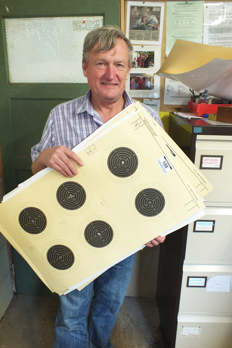 Photograph shows Alan Boyles presenting yet another batch of targets for scoring.