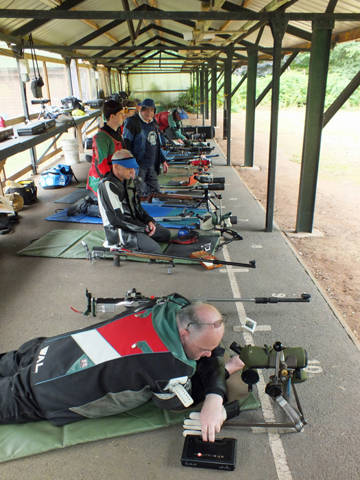 Photograph shows competitors on the firing line making those all important final checks before the detail commences.