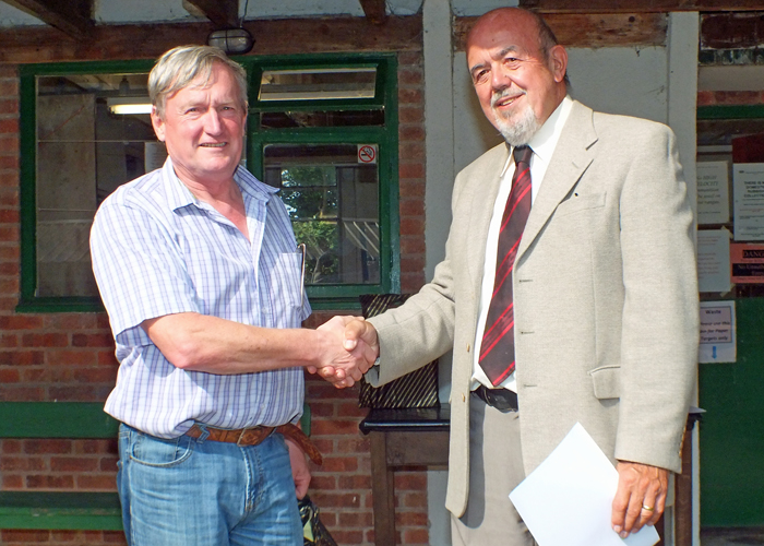 Photograph shows Alan Boyles (pictured left) receiving the Class 'D' 2nd Place Open Prize 2019 from SSRA Chairman - Richard Tilstone (pictured right).