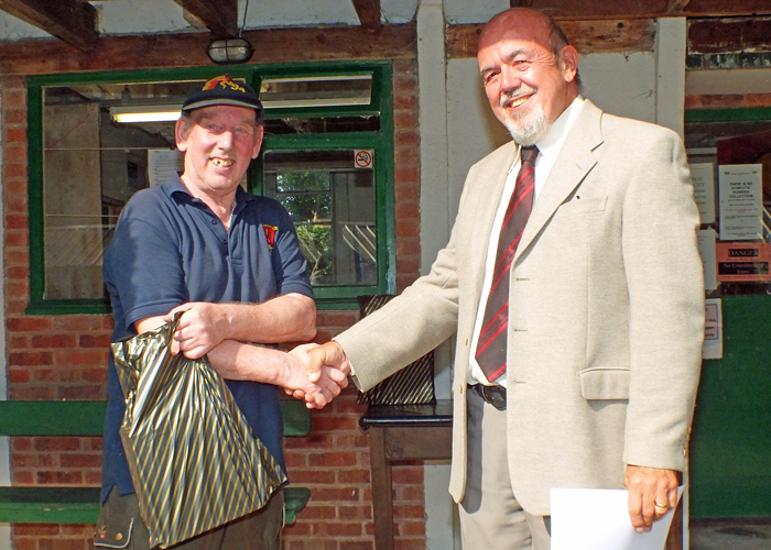 Photograph shows Brian Parker (pictured left) receiving the Class 'D' 1st Place Open Prize 2019 from SSRA Chairman - Richard Tilstone (pictured right).