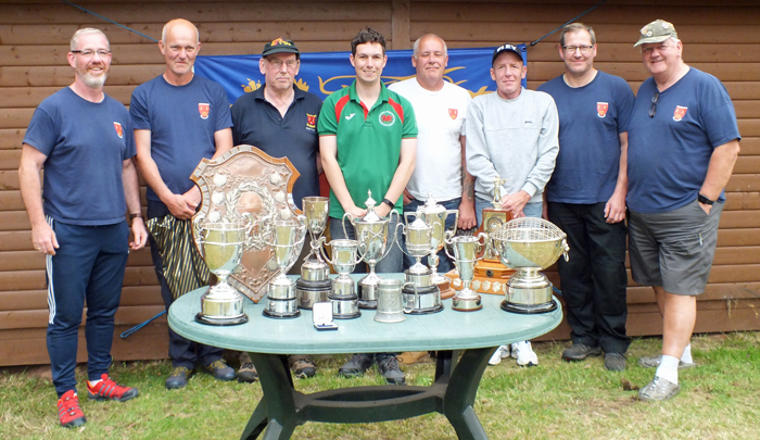 Photograph shows members of Rugeley Rifle Club proudly displaying its impressive collection of trophies won at the SSRA Combined Open Squadded Rifle Meeting 2019.