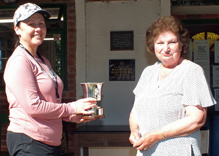 Photograph shows Mrs. Janet Troke (pictured right), presenting the Whitmore Cup to Debbie Trueman (pictured left).