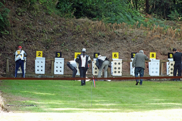 Photograph shows competitors making the long trek on the 50 Metres Range to change their targets.
