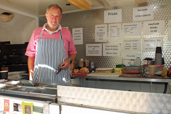 Photograph shows Jim Taylor manning his catering van whilst awaiting the rush of orders for his very tasty, and much appreciated food and refreshments