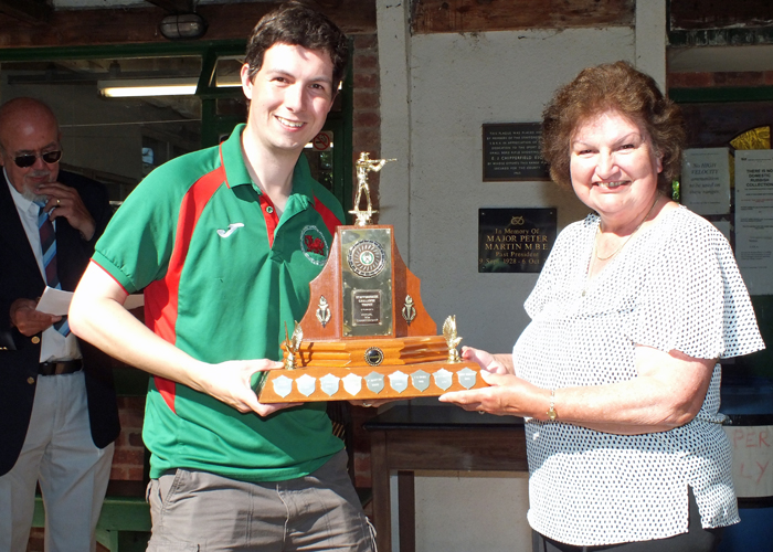 Photograph shows Mrs. Janet Troke (pictured right), presenting the 50 Metres Trophy to Richard Hemingway (pictured left).