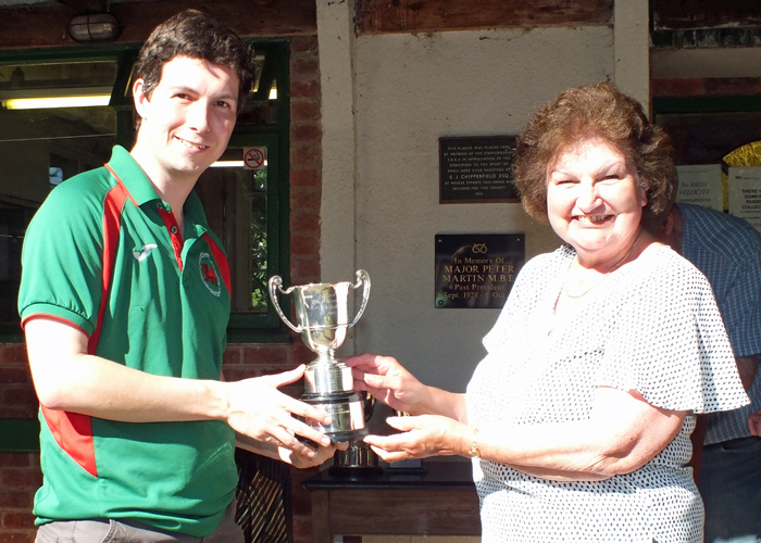 Photograph shows Mrs. Janet Troke (pictured right), presenting the Association Cup to Richard Hemingway (pictured left).