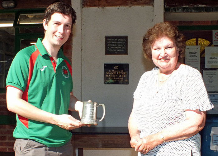Photograph shows Mrs. Janet Troke (pictured right), presenting the Astor Tankard to Richard Hemingway representing Rugeley Rifle Club (pictured left).