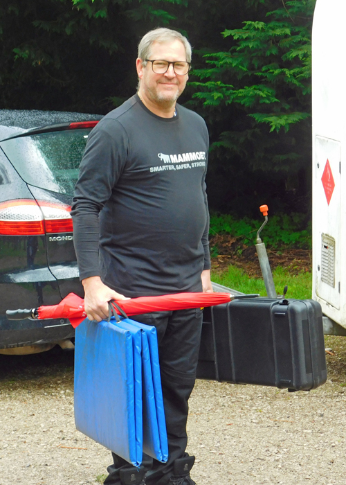 Photograph shows Paul Baron fully laden with some of his equipment, as he prepares for action.