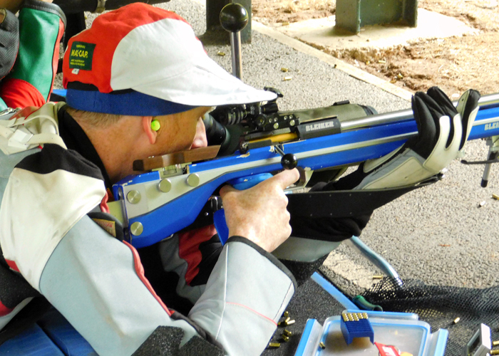 Photograph shows the intense concentration needed as this competitor takes aim.