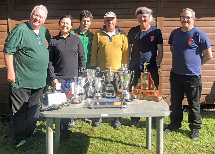 Photograph shows members of Rugeley Rifle and Pistol Club proudly displaying the trophies which they won at the SSRA Combined Open Squadded Rifle Meeting 2023.