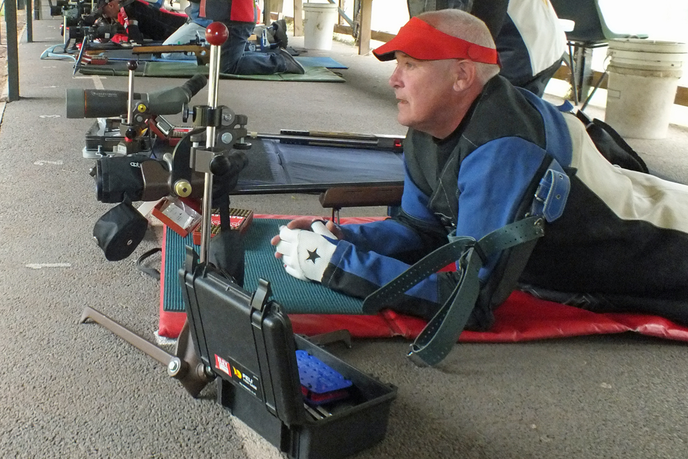 Photograph shows the concentration on the face of a competitor, as he settles into position.