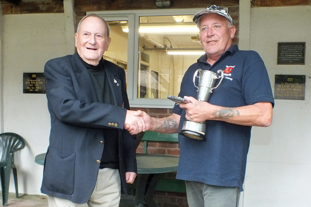 Photograph shows SSRA President - Mike B.P. Willcox (pictured left), presenting the Moat Cup for 2024 to Graham Delaney (pictured right).