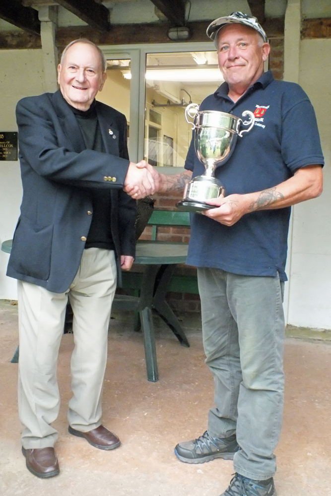 Photograph shows SSRA President - Mike B.P. Willcox (pictured left), presenting the R.W. De Nicolas Memorial Trophy for 2024 to Graham Delaney (pictured right).