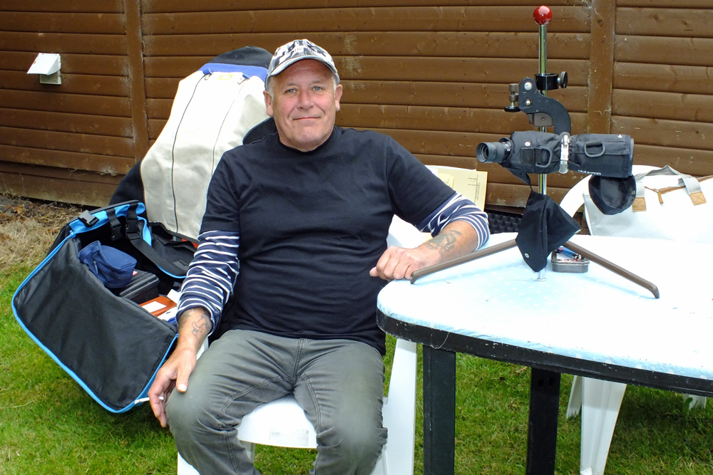 Photograph shows a very relaxed Graham Delaney taking a breather in the pleasant weather before his detail begins.