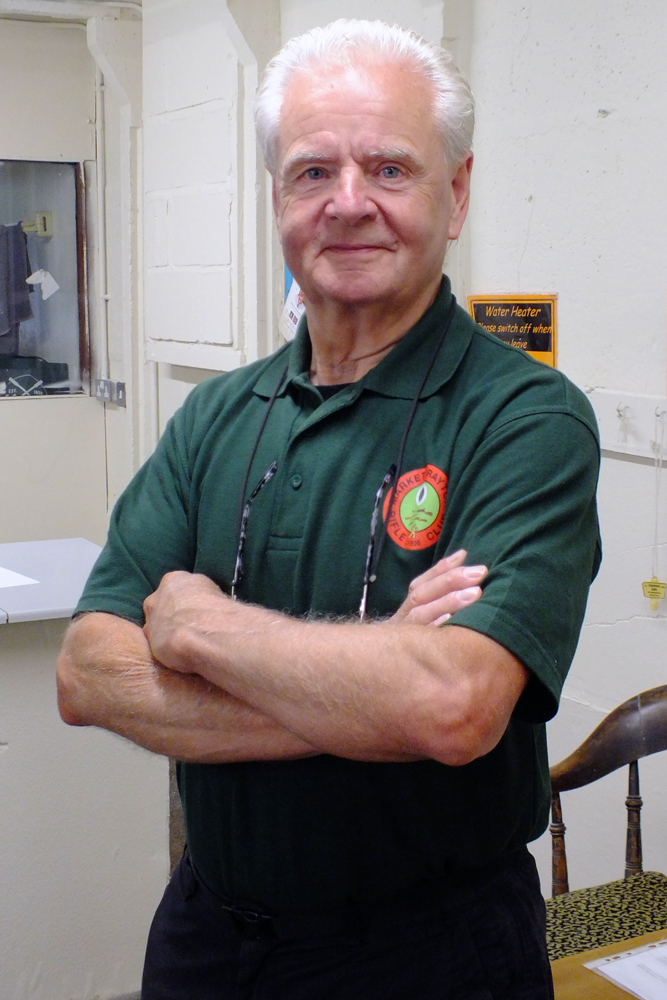 Photograph shows Tony Errington - a member of the shot-checking team - waiting for the first batch of targets to come in for scrutinising.