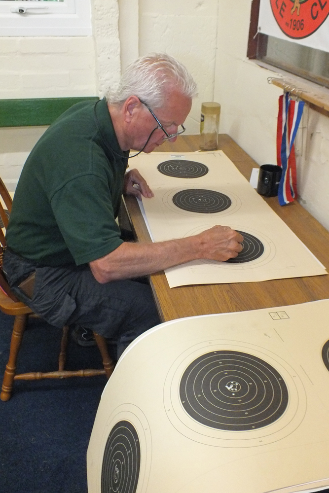 Photograph shows Tony Errington carefully checking the number of shots on each target - no mishaps so far!