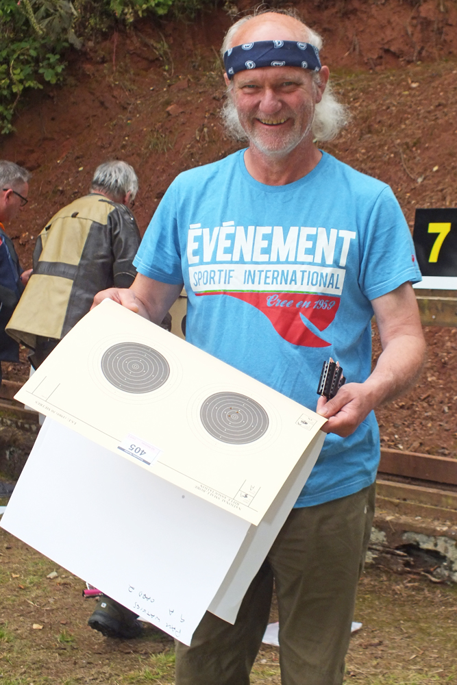 Photograph shows a satisfied Paul Watkiss, as he also takes the chance to replace his targets on the 50 metres range.